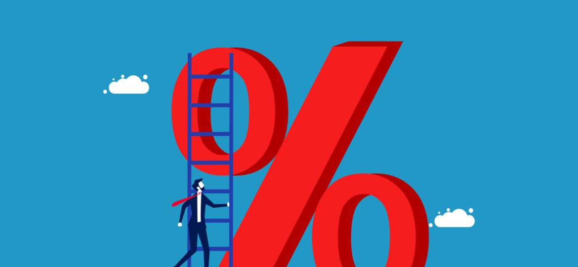 Interest rate. Businessman climbs on percentage icon with stairs