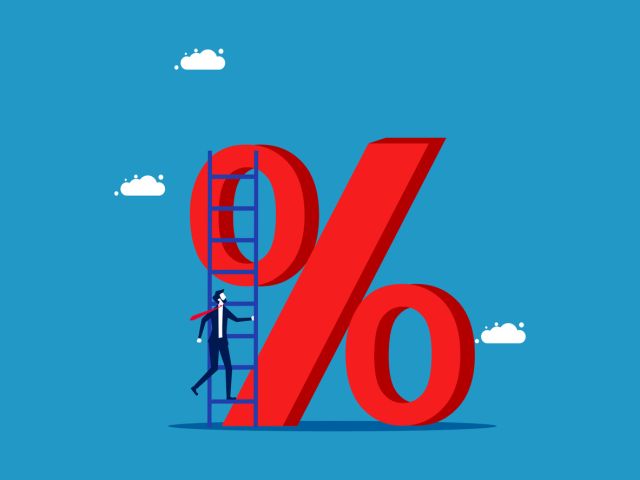 Interest rate. Businessman climbs on percentage icon with stairs